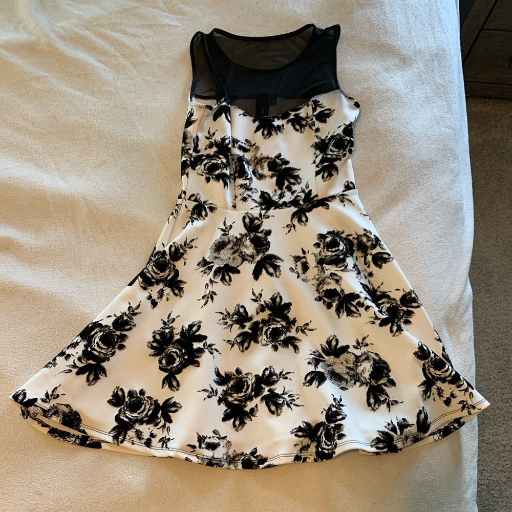 Fun short black and white dress with netted top.